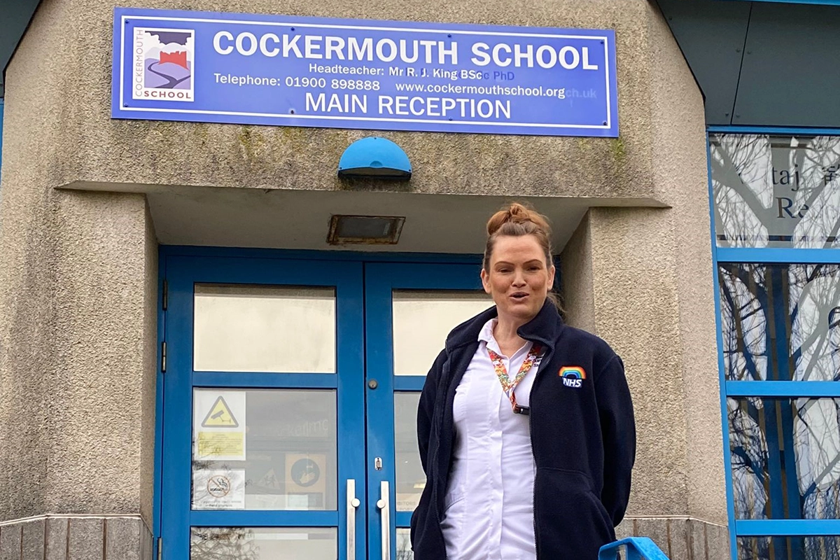 Image of Tania out site a school